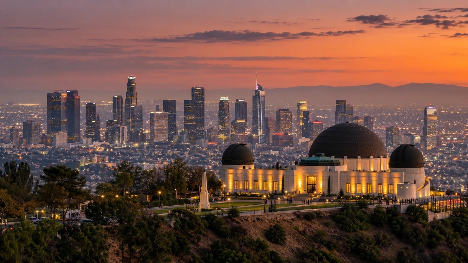 Griffith Observatory glowing at sunset above the Los Angeles skyline